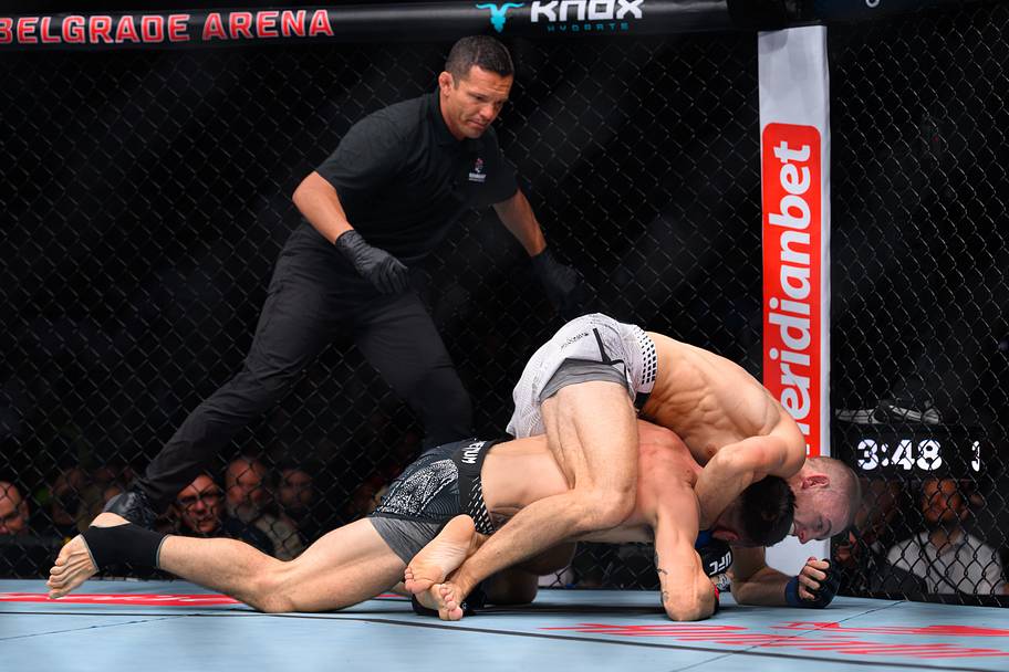 Milos Janicic (red gloves) fights Noah Gugnon (blue gloves) during UFC Fight Night at Belgrade Arena.