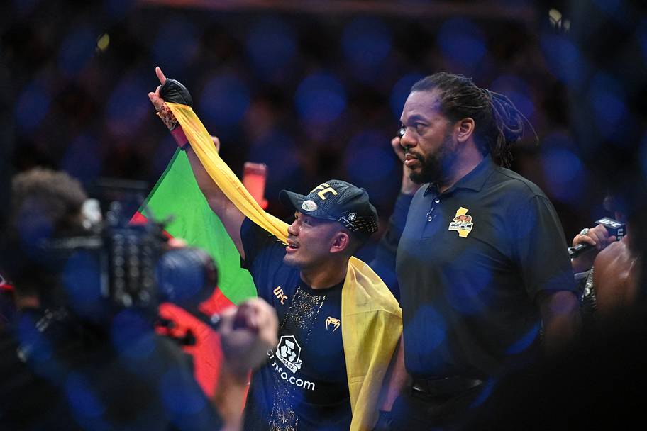 Joshua Van (red gloves) reacts after defeating Alexandre Pantoja (not pictured) in the flyweight title bout during UFC 331 at