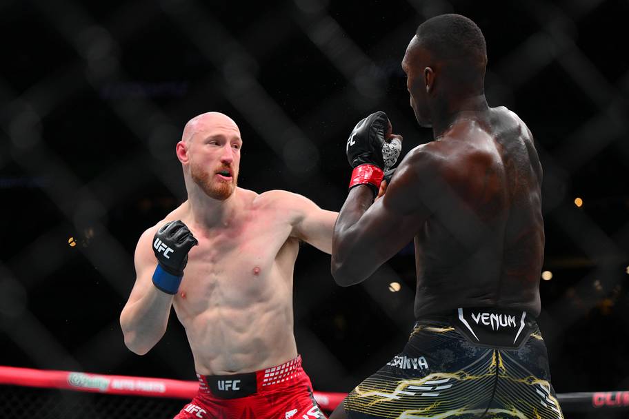 Israel Adesanya (red gloves) fights Joe Pyfer (blue gloves) during UFC Fight Night at Climate Pledge Arena.
