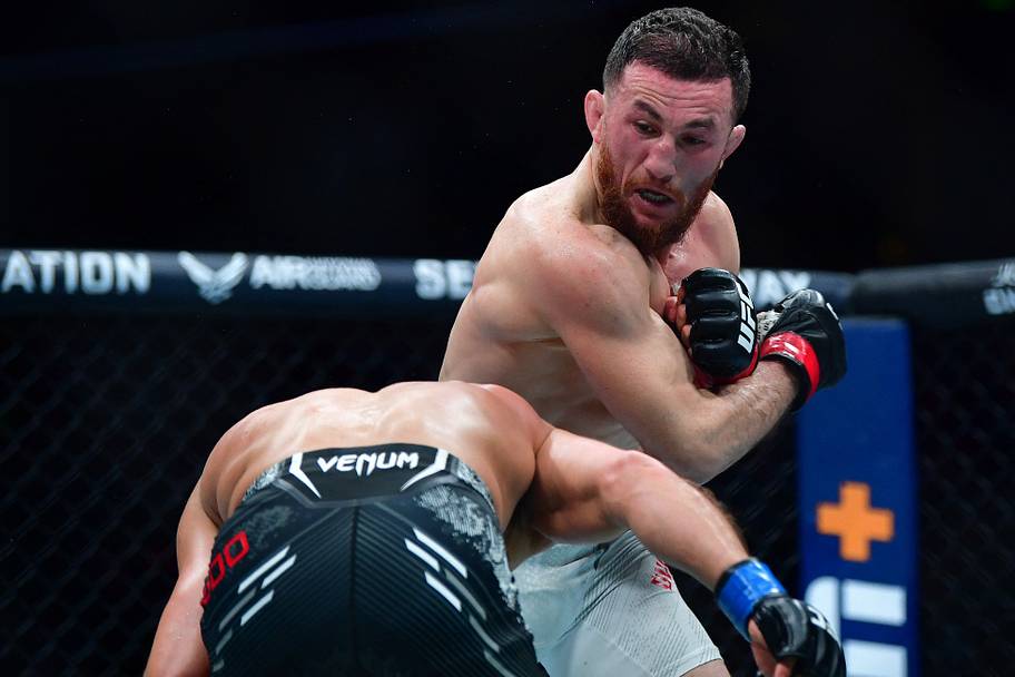 Merab Dvalishvili moves in with a hit against Henry Cejudo during UFC 298 at Honda Center.