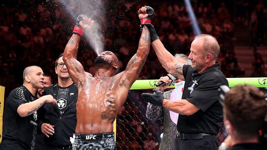 Bobby Green's hand is raised by the referee