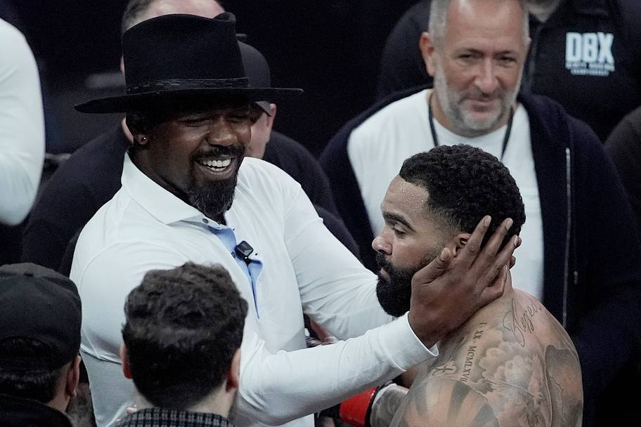 Gable Stevenson celebrates with Jon Jones after defeating Billy Swanson in a Dirty Boxing Championship heavyweight fight.