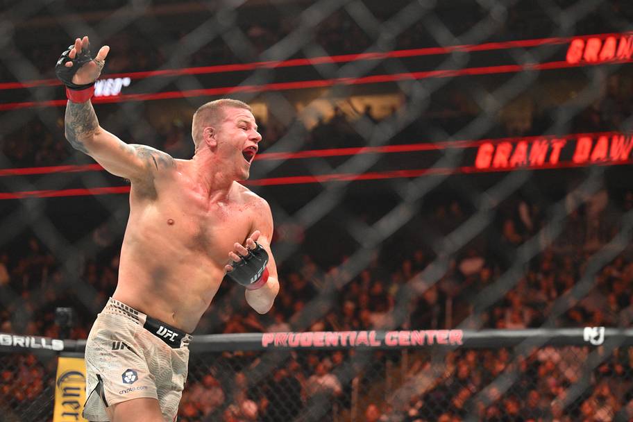 Grant Dawson (red gloves) celebrates after the fight against Mateusz Rebecki (blue gloves) during UFC 328 at Prudential Cent