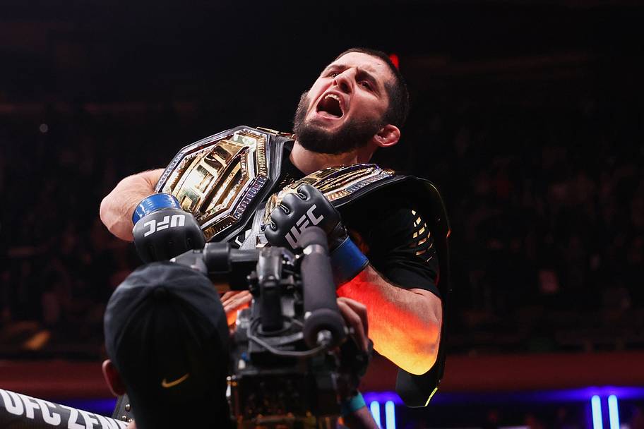 Islam Makhachev (blue gloves) celebrates after defeating Jack Della Maddalena (not pictured) by unanimous decision in the wel