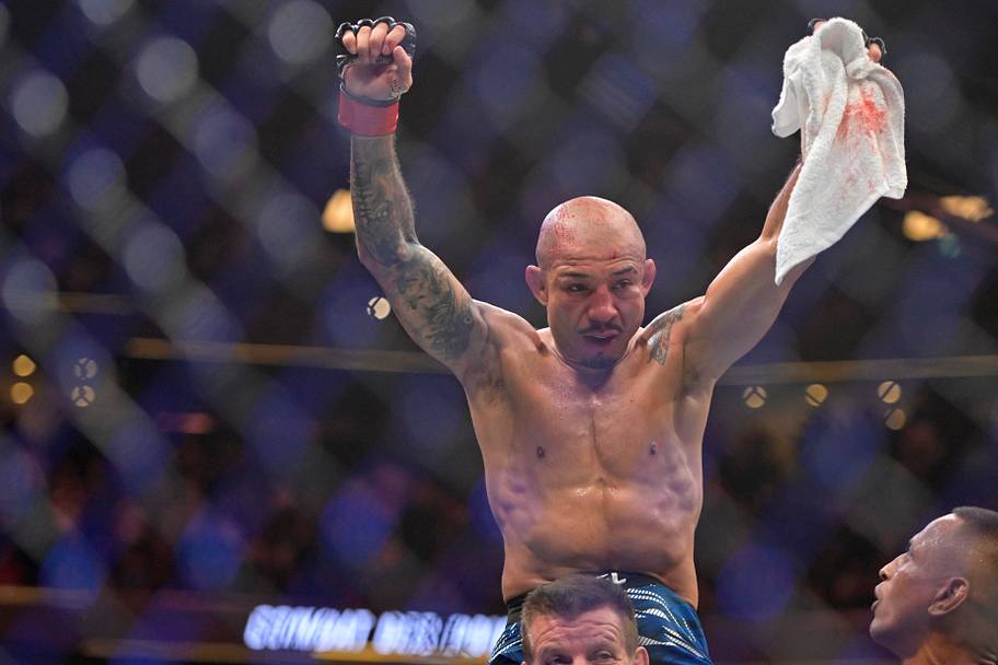 Jose Aldo (red gloves) reacts after a fight with Aiemann Zahabi (not pictured) during UFC 315 at Bell Centre.