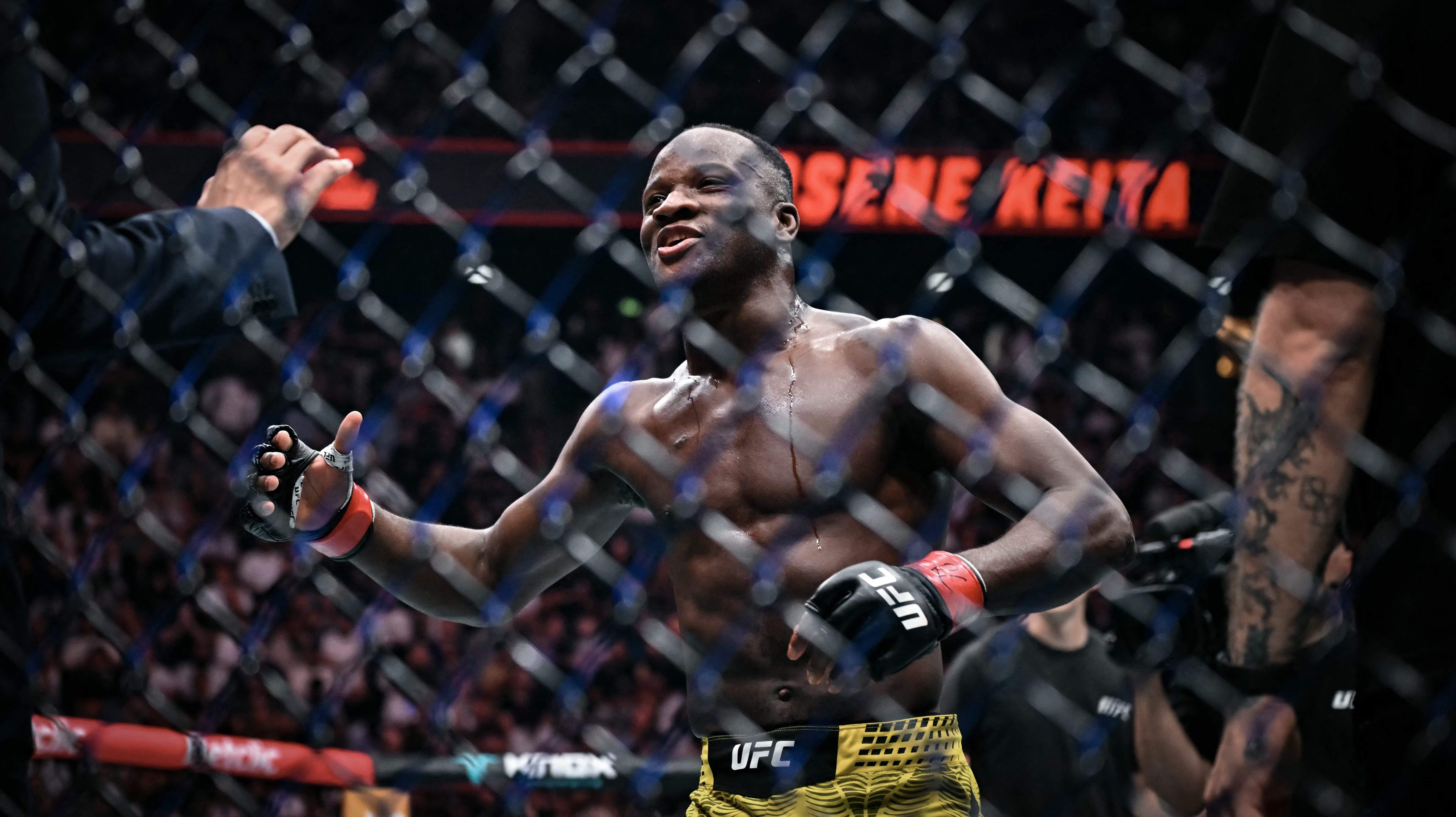 Belgian Losene Keita celebrates after winning against Tajik Muhammad Naimov in the featherweight divisionduring their mixed martial arts (MMA) at the 5th edition of the Ultimate Fighting Championship (UFC) at the Bercy Accor Arena, in Paris, on September 5, 2026. (Photo by LOU BENOIST / AFP via Getty Images)