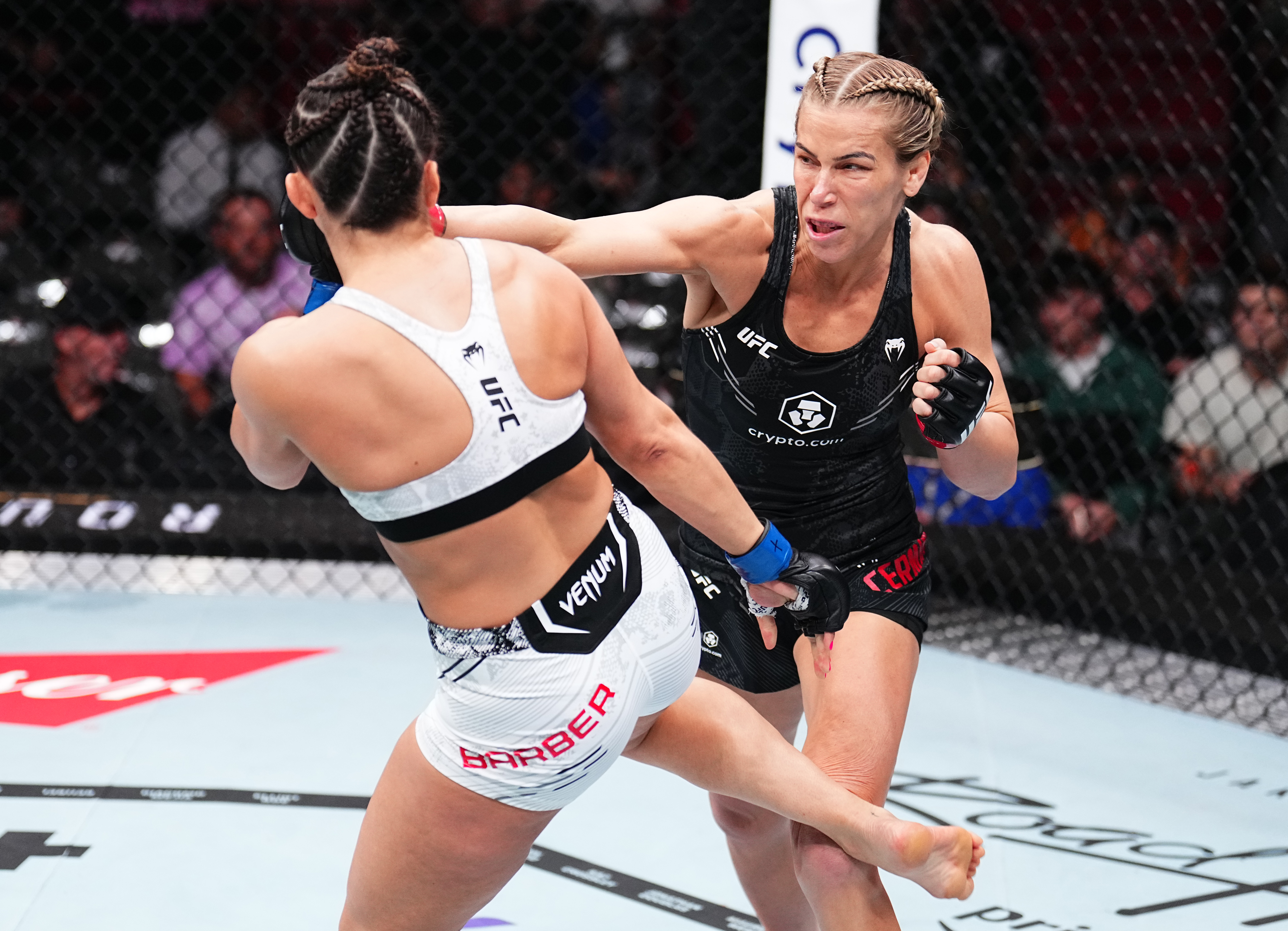 MIAMI, FLORIDA - MARCH 09: (R-L) Katlyn Cerminara punches Maycee Barber in a flyweight fight during the UFC 299 event at Kaseya Center on March 09, 2024 in Miami, Florida. (Photo by Chris Unger/Zuffa LLC via Getty Images)