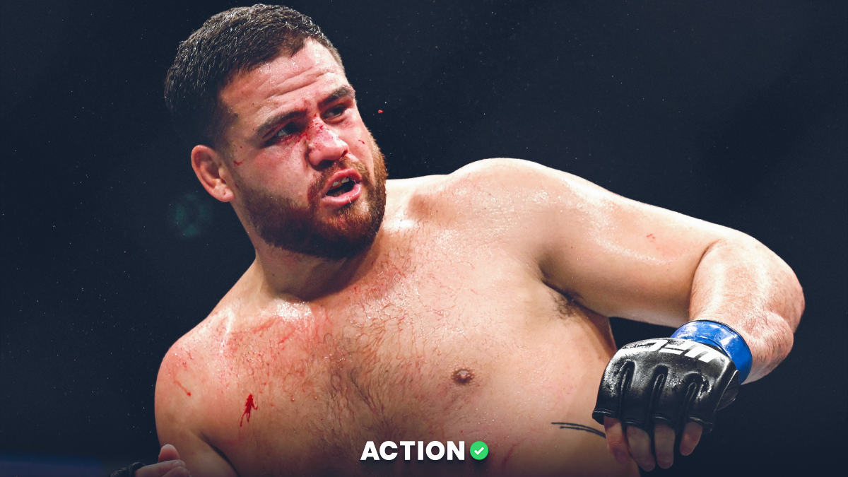 Sep 3, 2022; Paris, FRANCE; Tai Tuivasa (blue gloves) reacts during the fight against Ciryl Gane during UFC Fight Night at Accor Arena. Mandatory Credit: Per Haljestam-USA TODAY Sports