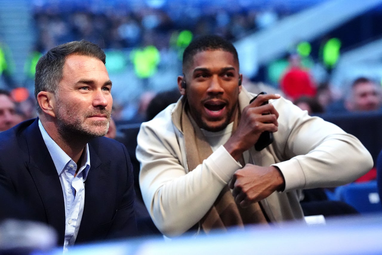 Fury has accused Eddie Hearn (left) and Anthony Joshua (right) of jeopardising the fight (PA Wire)