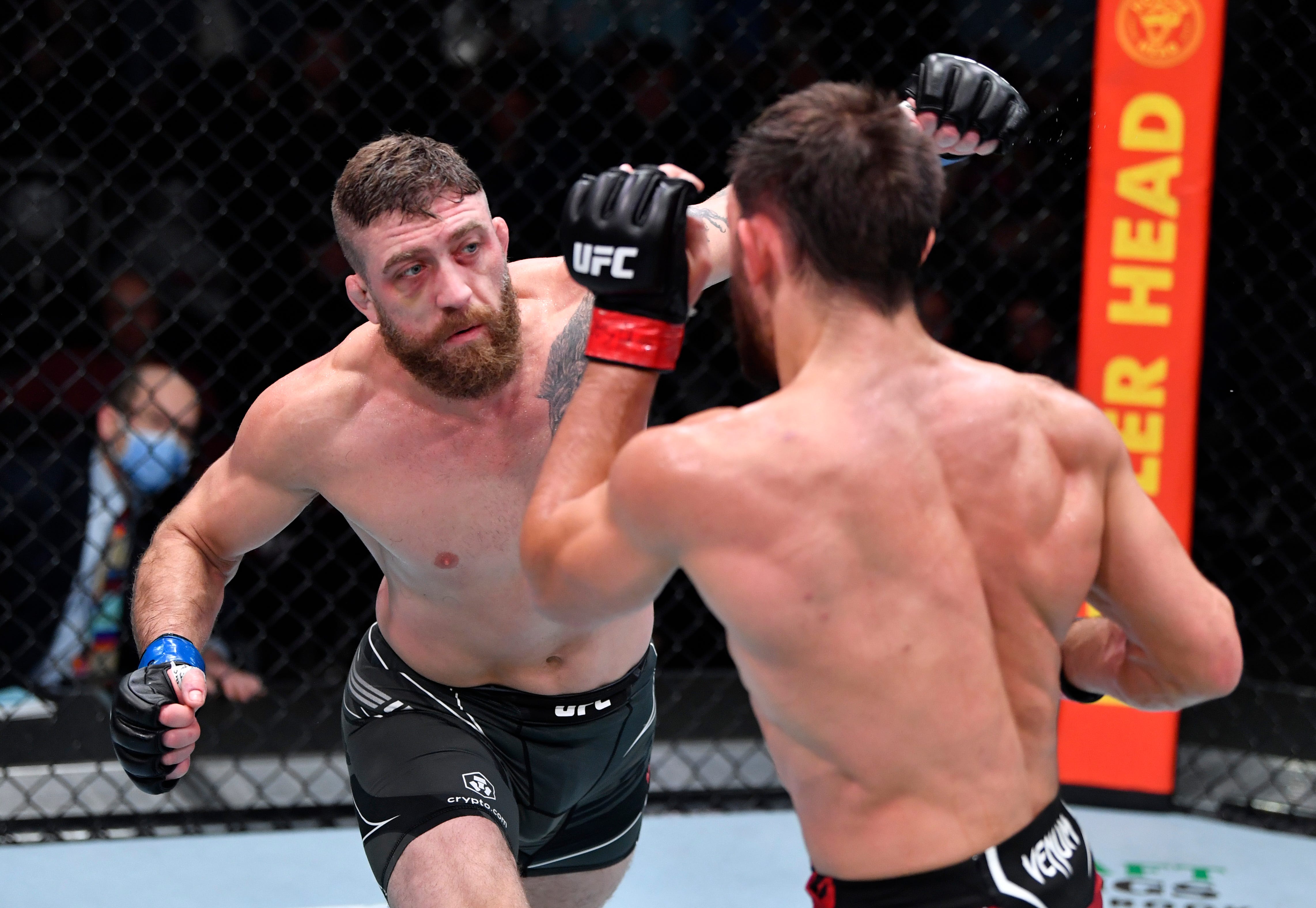 LAS VEGAS, NEVADA - DECEMBER 18: (L-R) Gerald Meerschaert punches Dustin Stoltzfus in their middleweight fight during the UFC Fight Night event at UFC APEX on December 18, 2021 in Las Vegas, Nevada. (Photo by Jeff Bottari/Zuffa LLC)