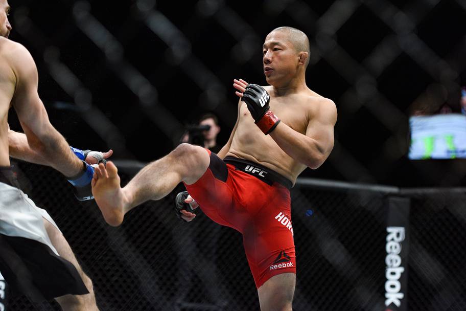 Kyoji Horiguchi (red gloves) fights Ali Bagautinov (blue gloves) during UFC Fight Night at SSE Arena.