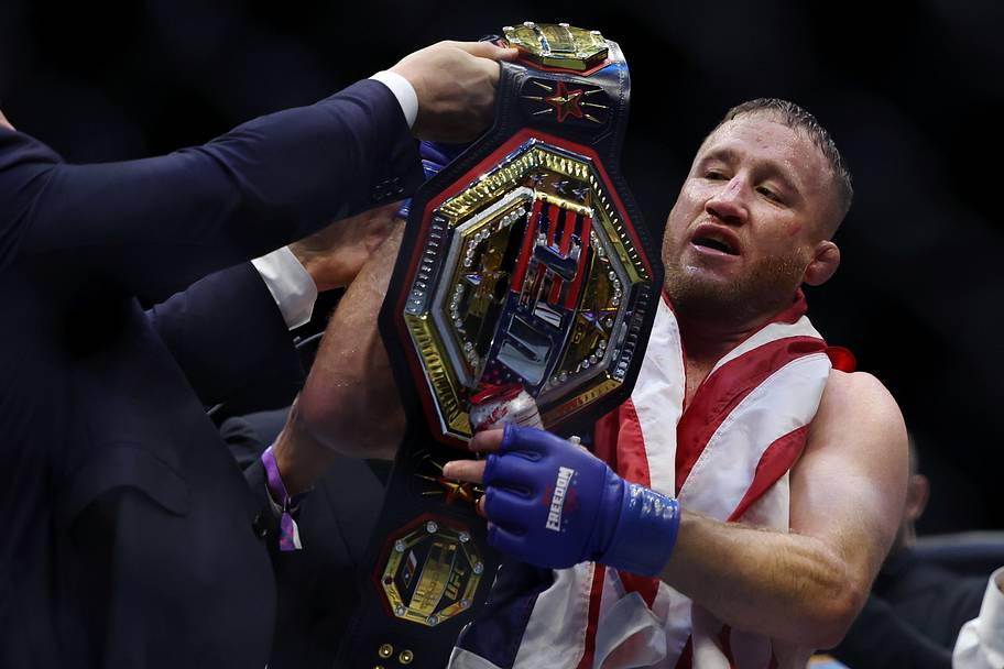 Justin Gaethje (blue gloves) celebrates after winning the UFC Freedom 250 fight against Ilia Topuria (not pictured) at the Wh