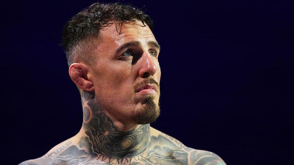 Head and shoulders view of heavily tattooed Tom Aspinall