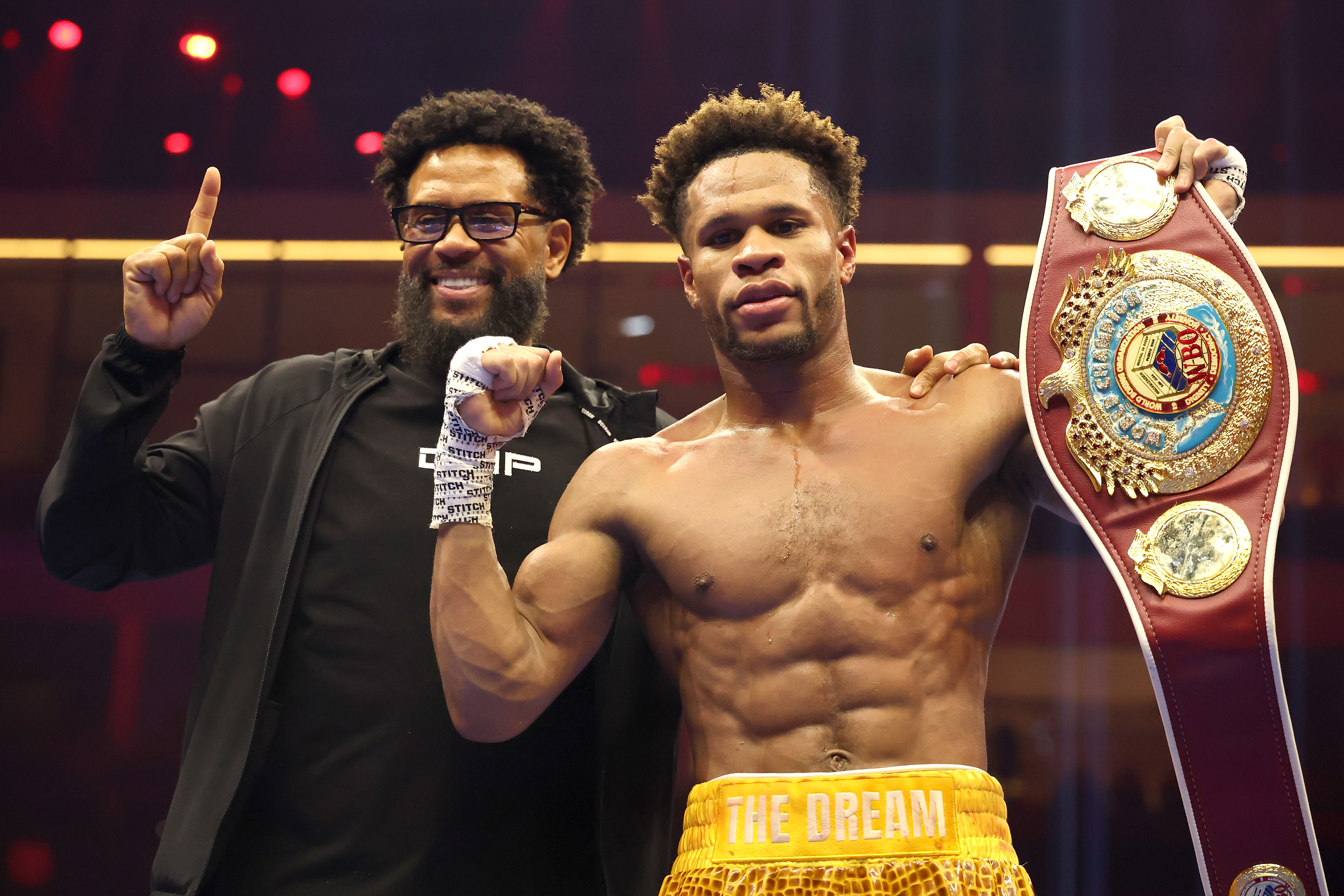 RIYADH, SAUDI ARABIA - NOVEMBER 22: Devin Haney (R) poses with his father, Bill Haney, after defeating Brian Norman Jr. by unanimous decision in a WBO world welterweight title fight during Ring IV: Night of the Champions at ANB Arena on November 22, 2025 in Riyadh, Saudi Arabia. (Photo by Richard Pelham/Getty Images)