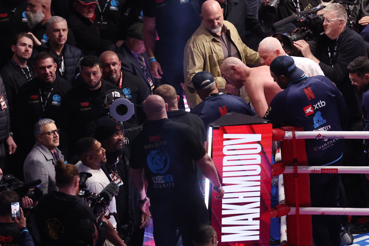 Tyson Fury (centre-right) and Anthony Joshua exchanging words after Fury’s win over Arslanbek Makhmudov in April (Getty)