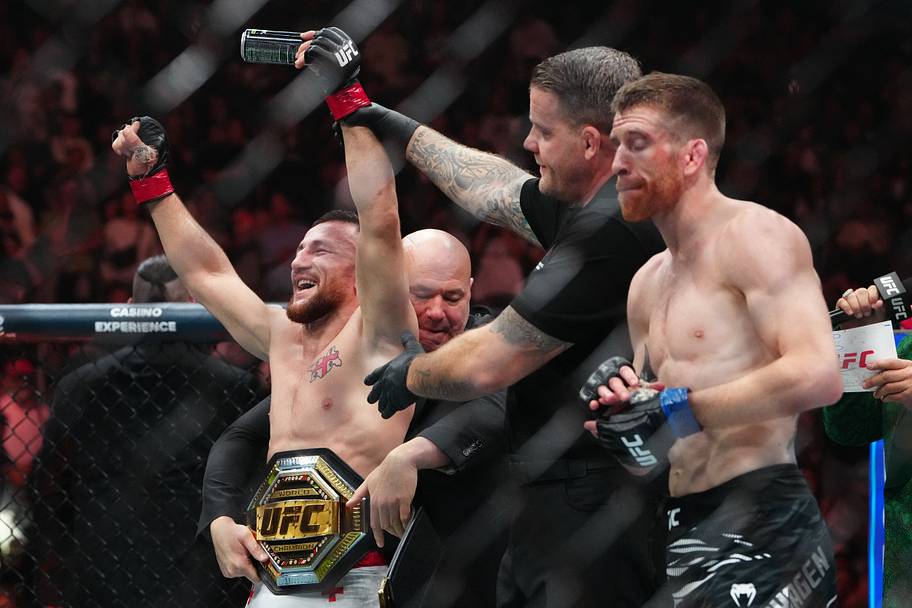 Merab Dvalishvili (red gloves) reacts after the fight against Cory Sandhagen (blue gloves) during UFC 320 at T-Mobile Arena.