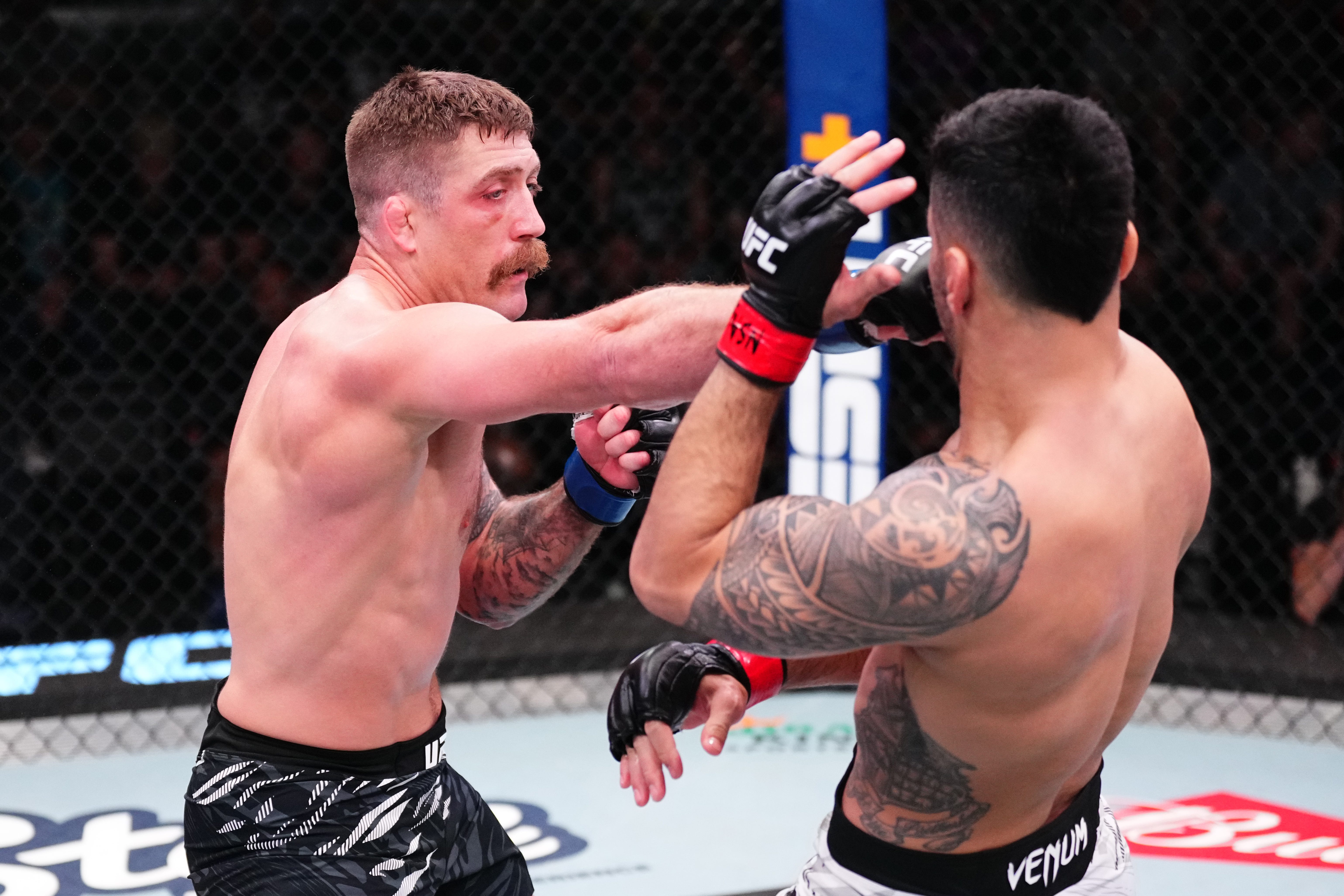 LAS VEGAS, NEVADA - APRIL 05: (L-R) Gerald Meerschaert punches Brad Tavares in their middleweight fight during the UFC Fight Night event at UFC APEX on April 05, 2025 in Las Vegas, Nevada. (Photo by Jeff Bottari/Zuffa LLC)