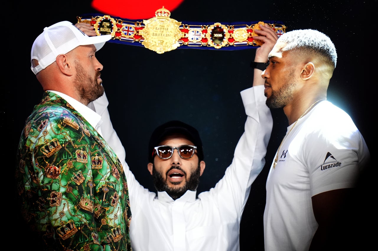Tyson Fury (left) and Anthony Joshua face off (John Walton/PA)