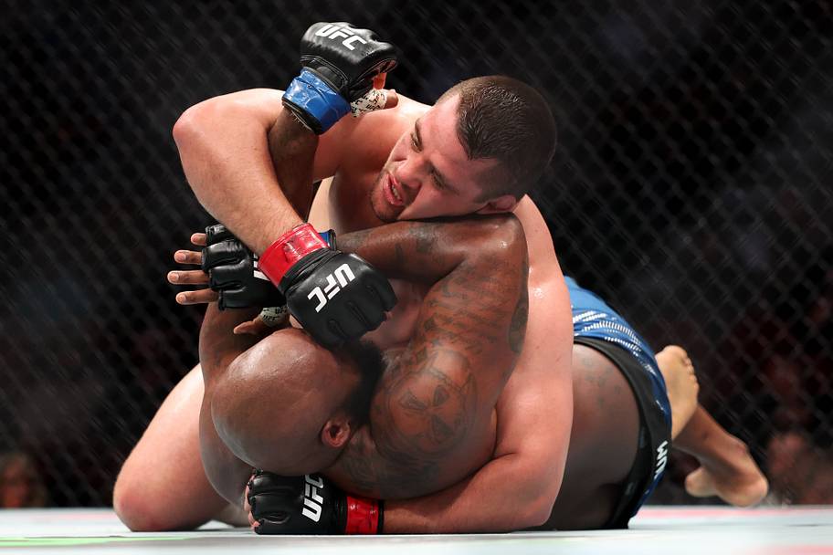 Thomas Petersen (red gloves) fights Don'tale Mayes (blue gloves) during UFC Fight Night at Wells Fargo Arena.