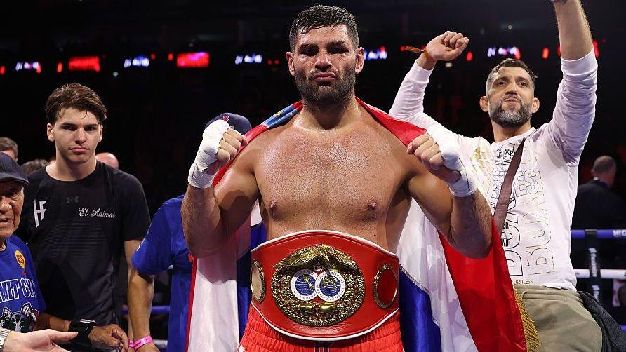 Filip Hrgovic has the IBF heavyweight title around his waist and holds up his fists