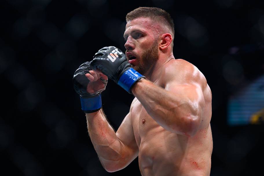 Robert Bryczek (blue gloves) fights Brad Tavares (red gloves) during UFC Fight Night at Accor Arena.