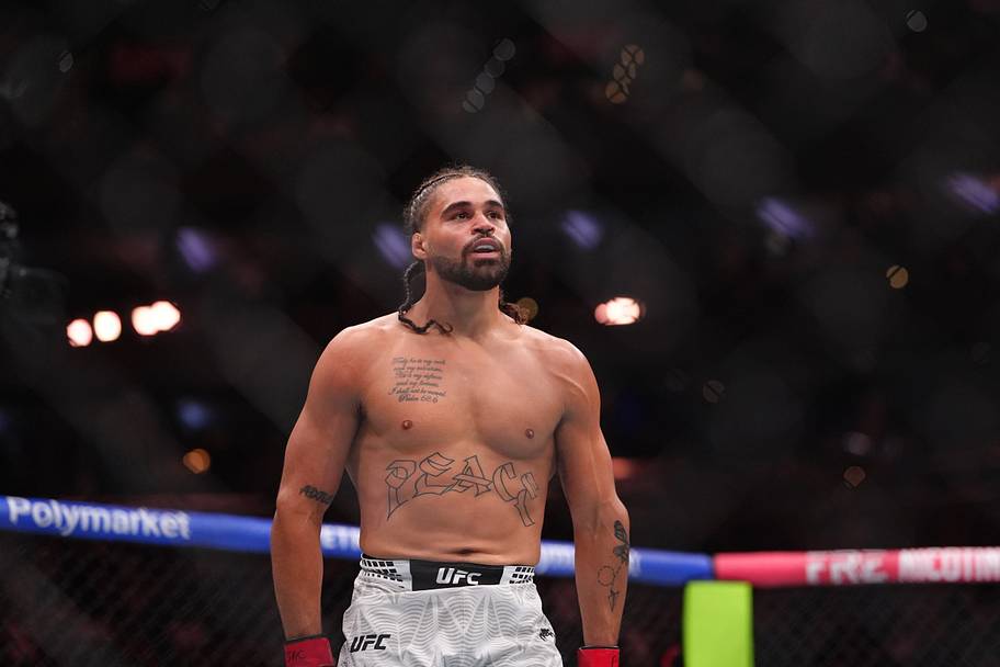 Donte Johnson (red gloves) fights against Eric McConico (blue gloves) in the middleweight bout during UFC 330 at Xfinity Mobi