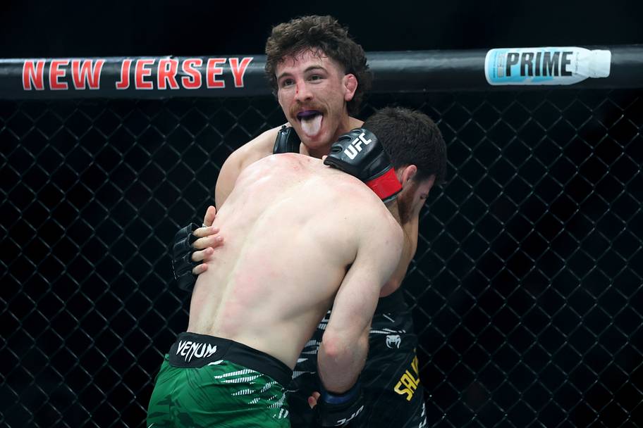 Quillan Salkilld (red gloves) fights Yanal Ashmouz (blue gloves) during UFC 316 at Prudential Center.