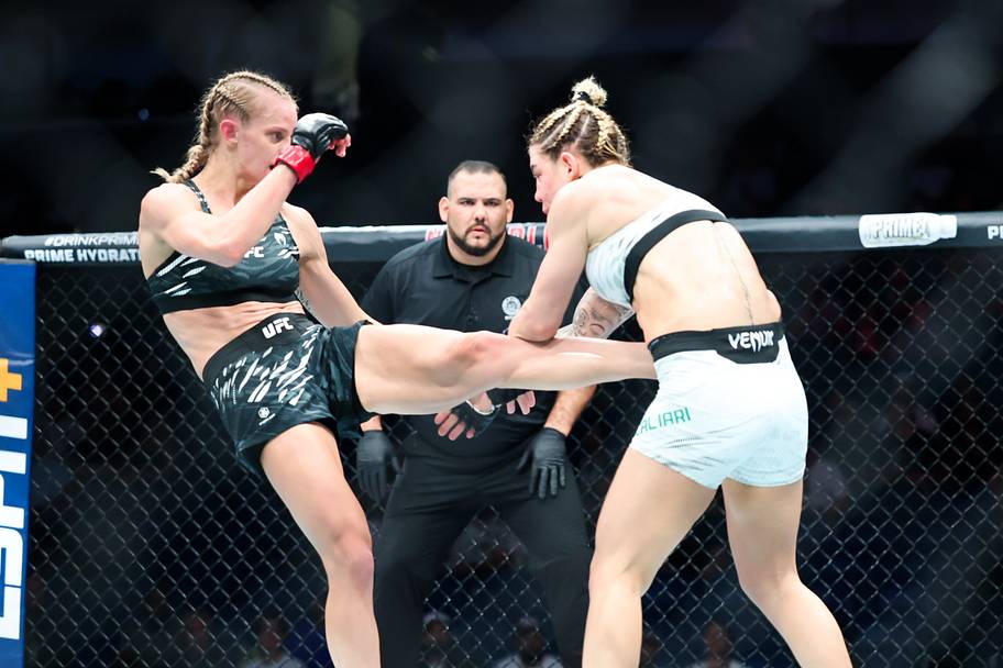 Carli Judice (red gloves) fights against Nicolle Caliari (blue gloves) during UFC 318 at Smoothie King Center.