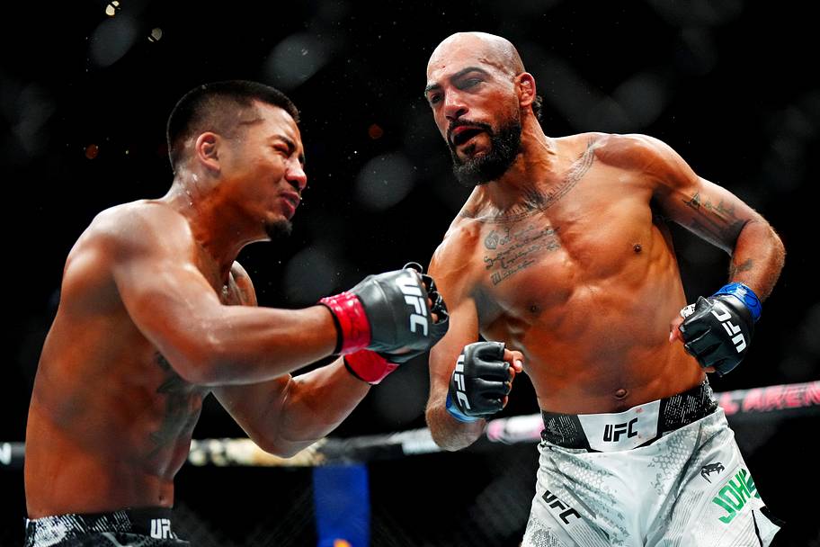 Charles Johnson (blue gloves) knocks out Joshua Van (red gloves) during UFC Fight Night at Ball Arena.