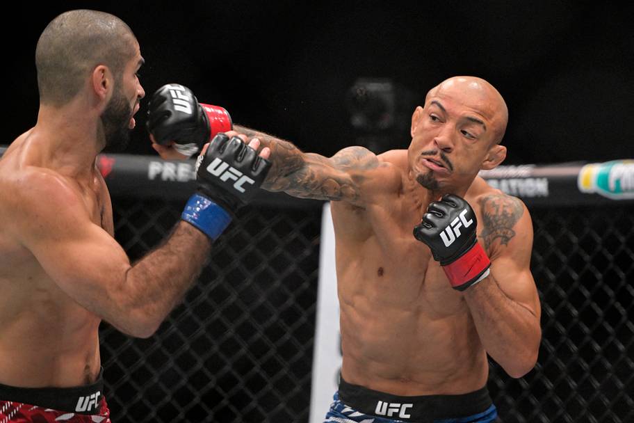 Jose Aldo (red gloves) fights Aiemann Zahabi (blue gloves) during UFC 315 at Bell Centre.