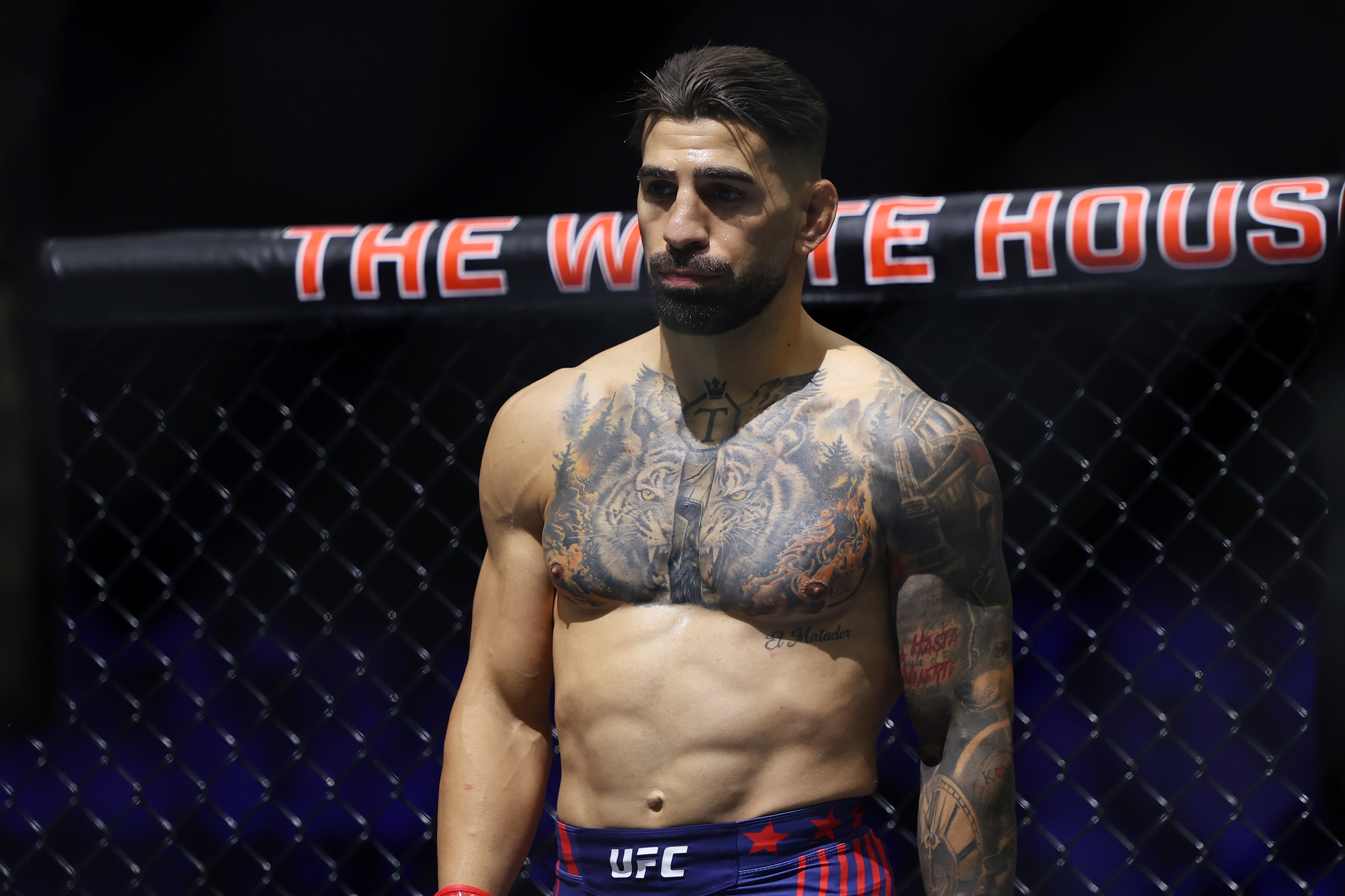 Jun 14, 2026; Washington, D.C., USA; Ilia Topuria (red gloves) looks on prior to his fight against Justin Gaethje (not pictured) during the UFC Freedom 250 at the White House South Lawn. Mandatory Credit: Amber Searls-Imagn Images