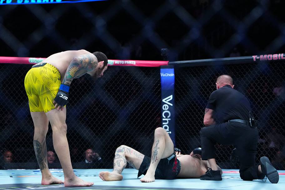 Rodolfo Bellato (blue gloves) reacts after defeating Luke Fernandez (red gloves) during UFC 326 at T-Mobile Arena.