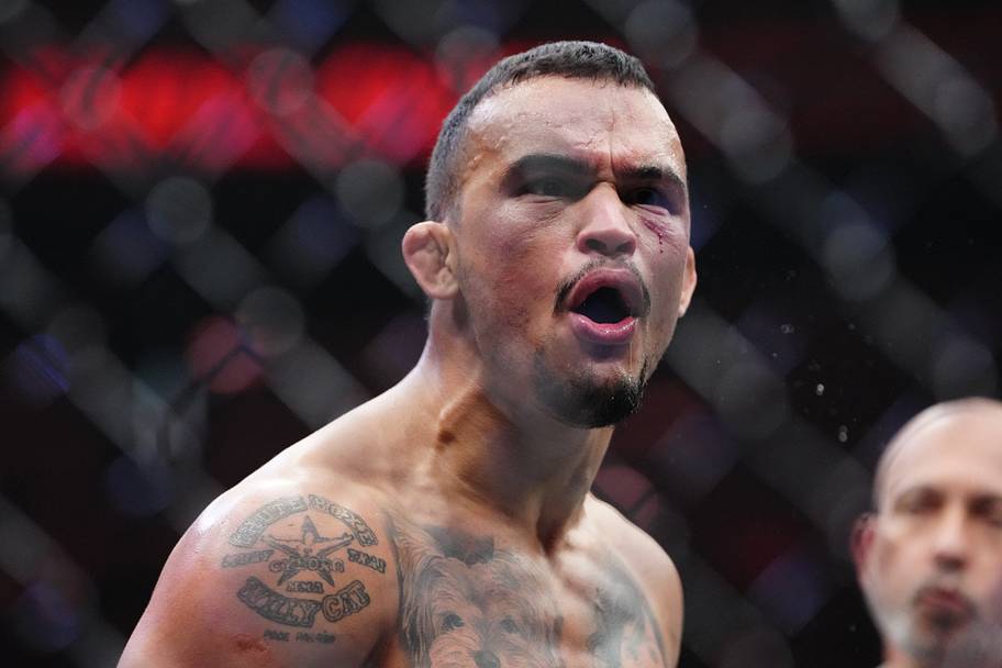 Daniel Santos (red gloves) reacts after the fight against Joosang Yoo (blue gloves) during UFC 320 at T-Mobile Arena.