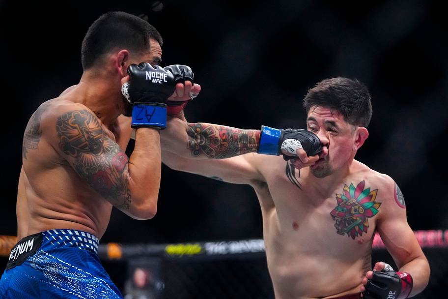 Brandon Moreno and Joseph Morales fight during Noche UFC at Desert Diamond Arena in Glendale.