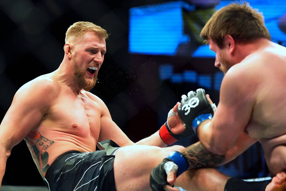 Alexander Volkov (red gloves) fights Alexander Romanov (blue gloves) during UFC Fight Night at Virgin Hotel.