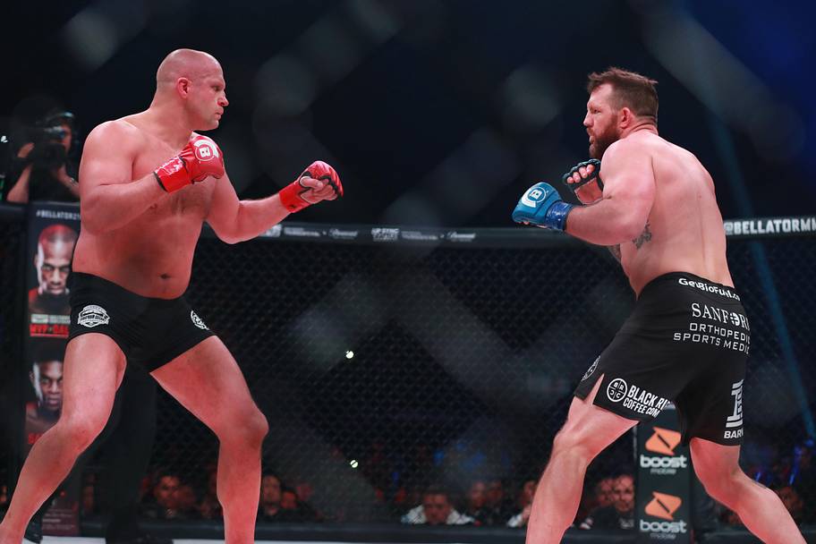Ryan Bader (blue gloves) and Fedor Emelianenko (red gloves) during Bellator 214 at The Forum.