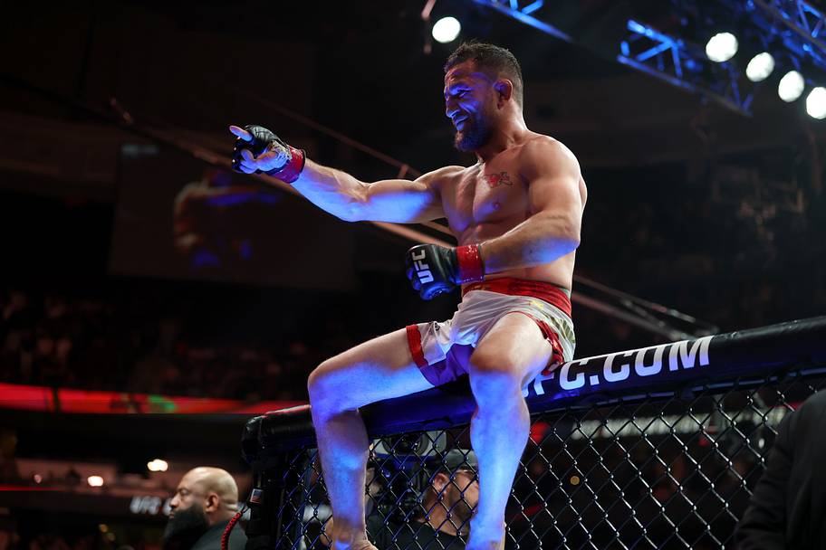 Merab Dvalishvili (red gloves) reacts after defeating Sean O'Malley (not pictured) in a bantamweight title fight during UFC 3