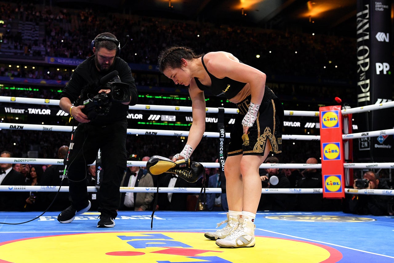 Final bow: Katie Taylor leaving her gloves in the ring after one final victory (Getty)