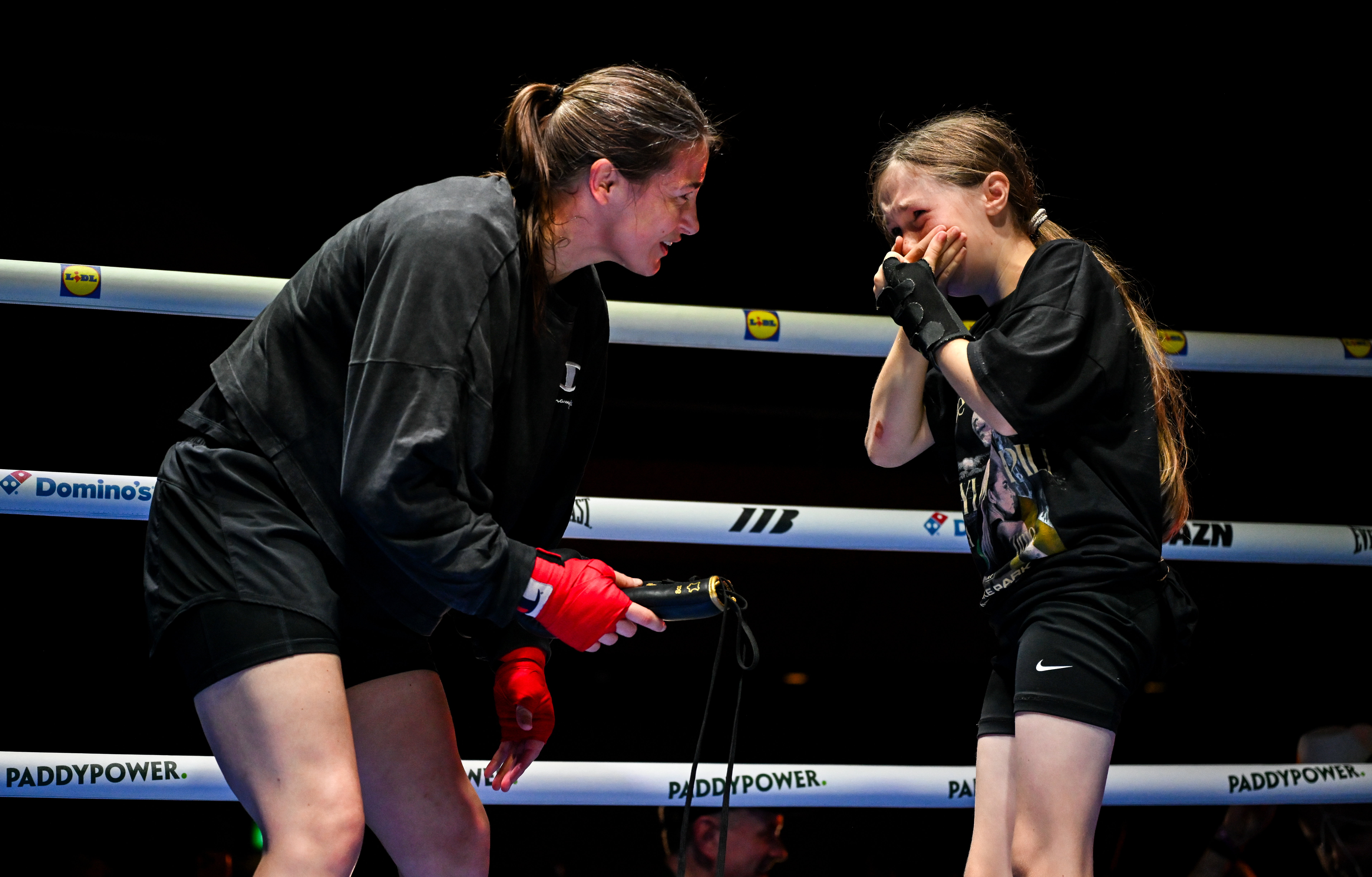 Dublin , Ireland - 2 September 2026; Katie Taylor with young fan Clodagh Keating, age 10, from Dublin, during a public workout session, held at The Helix in DCU, Dublin, ahead of her undisputed super lightweight championship fight with Flora Pili on September 5th at Croke Park in Dublin. (Photo By Stephen McCarthy/Sportsfile via Getty Images)