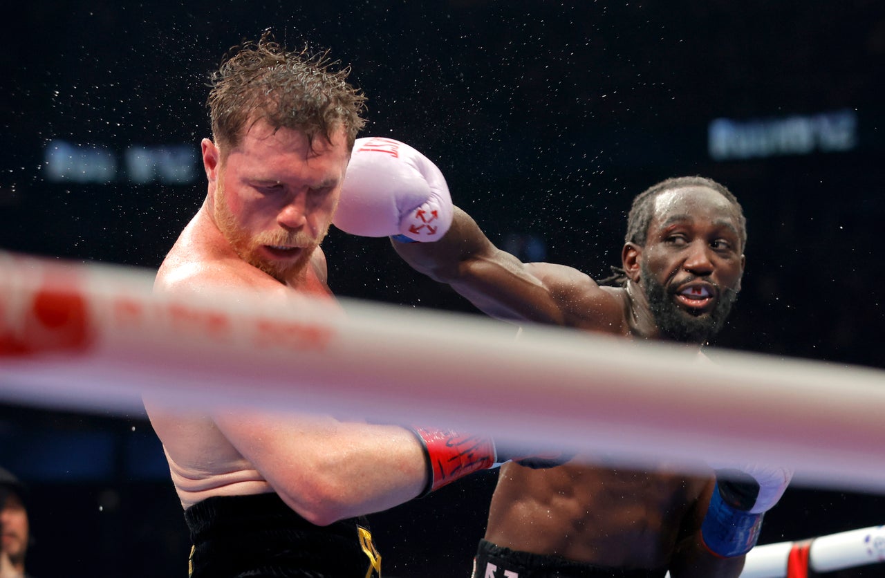 Terence Crawford (right) beat Canelo Alvarez in September 2025 to become a three-weight undisputed champion (Getty)