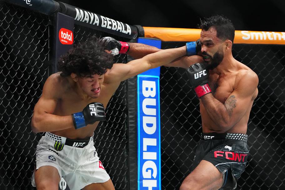 Rob Font (red gloves) fights Raul Rosas Jr. (blue gloves) during UFC 326 at T-Mobile Arena.