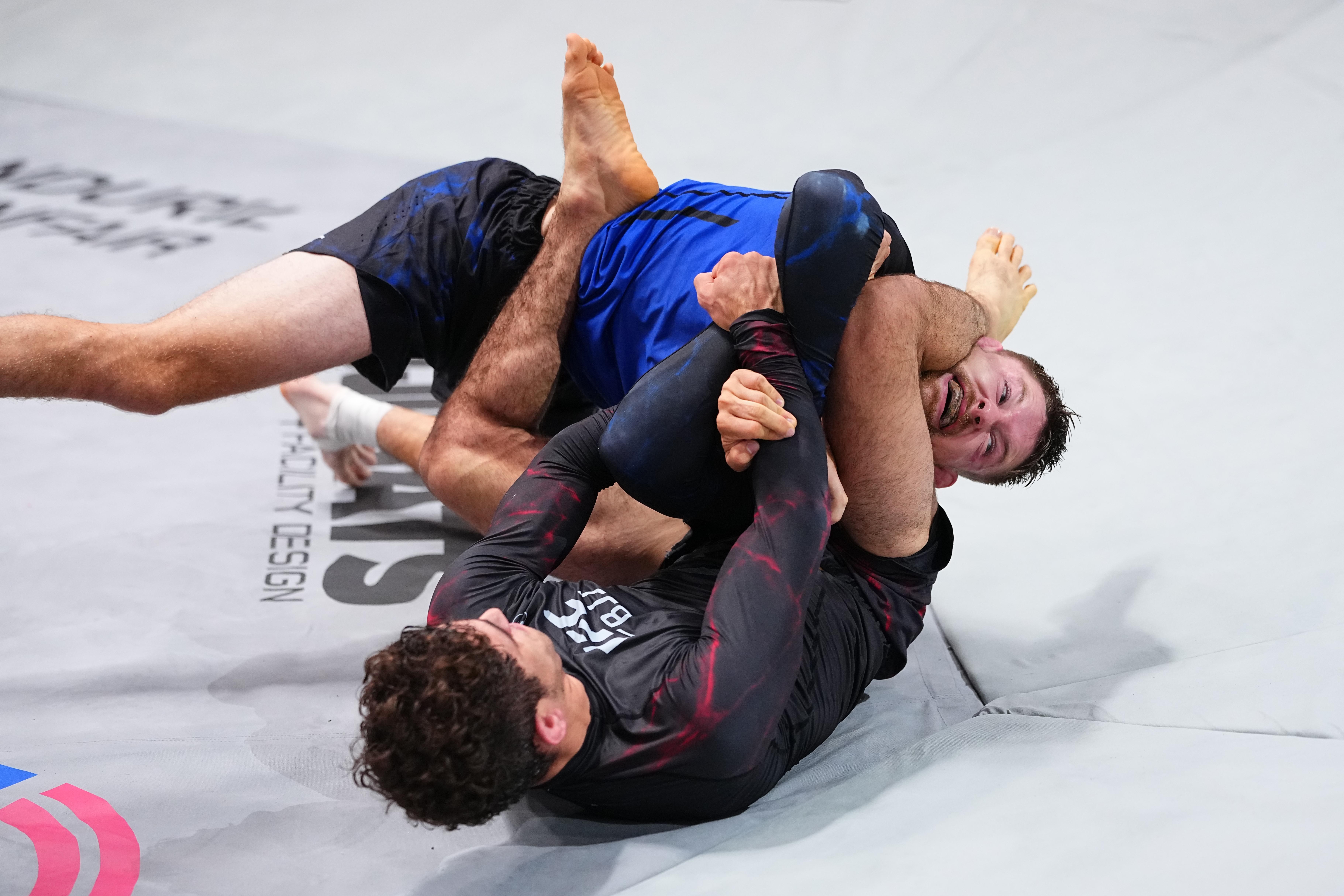 LAS VEGAS, NEVADA - SEPTEMBER 24: (L-R) Mikey Musumeci works for a submission against Bryce Mitchell in a featherweight match during the UFC BJJ 11 event at Meta APEX on September 24, 2026 in Las Vegas, Nevada.