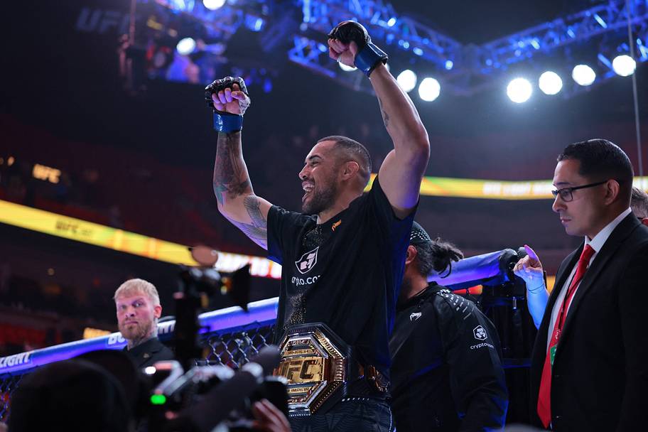 Carlos Ulberg (blue gloves) reacts after defeating Jiri Prochazka (red gloves) during UFC 327 at Kaseya Center.