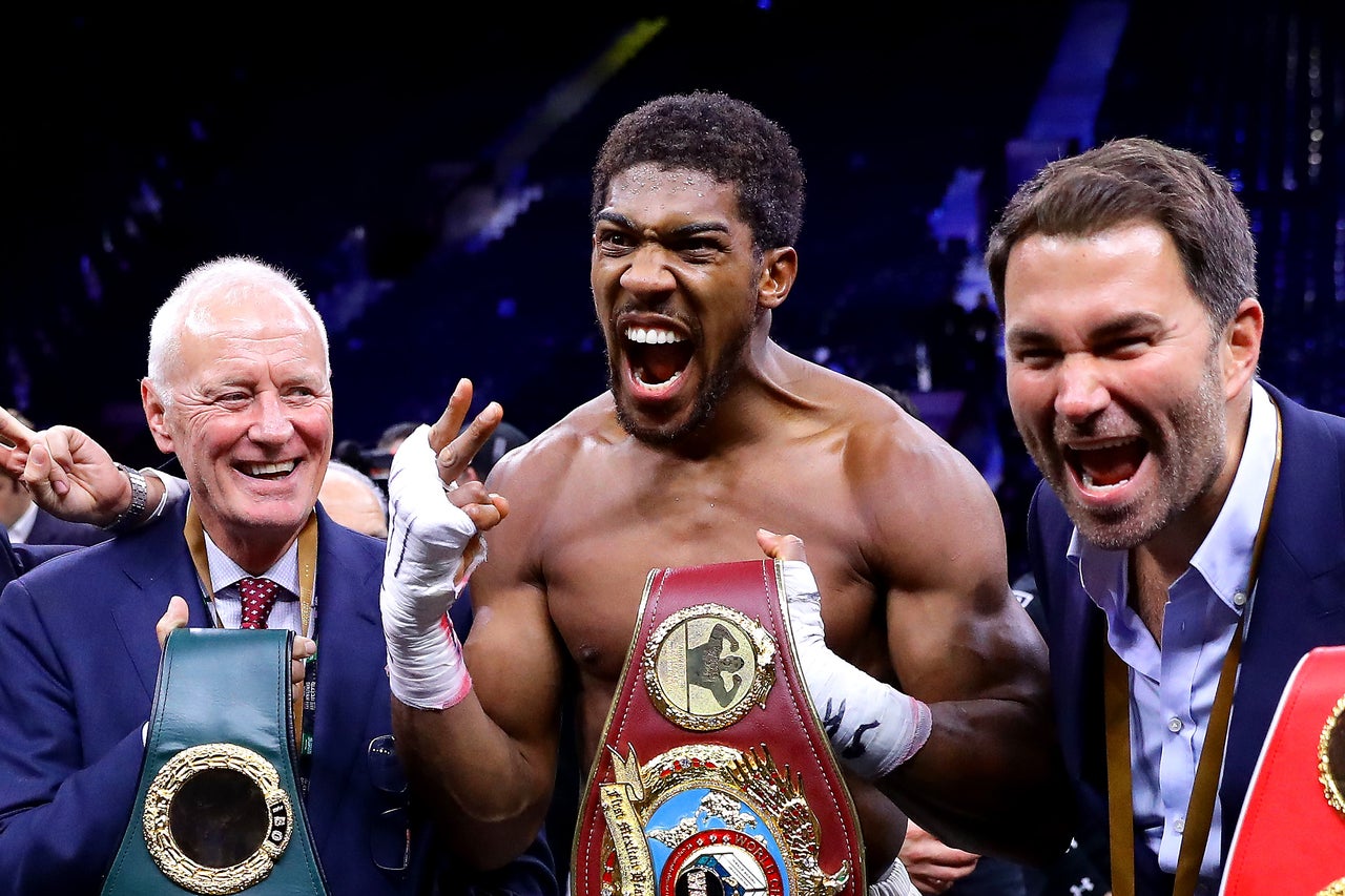 Barry Hearn (left) with his son Eddie (right) and Anthony Joshua (Getty)