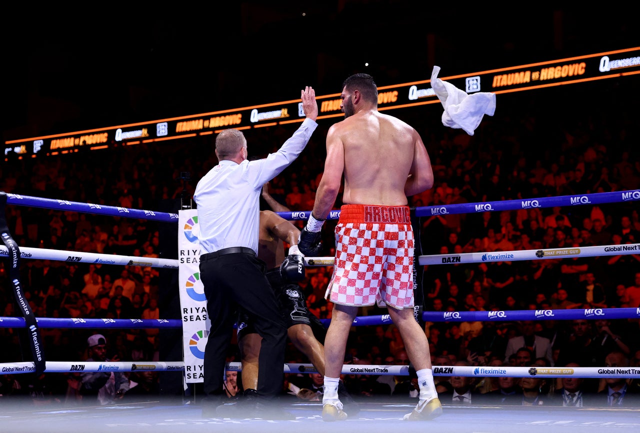 The team of Moses Itauma throw the towel against Filip Hrgovic (Reuters)
