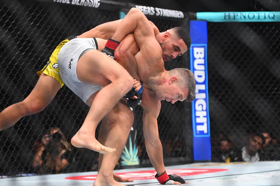 Stephen Thompson (red gloves) fights Gabriel Bonfim (blue gloves) in a welterweight bout during UFC Fight Night at Bridgeston