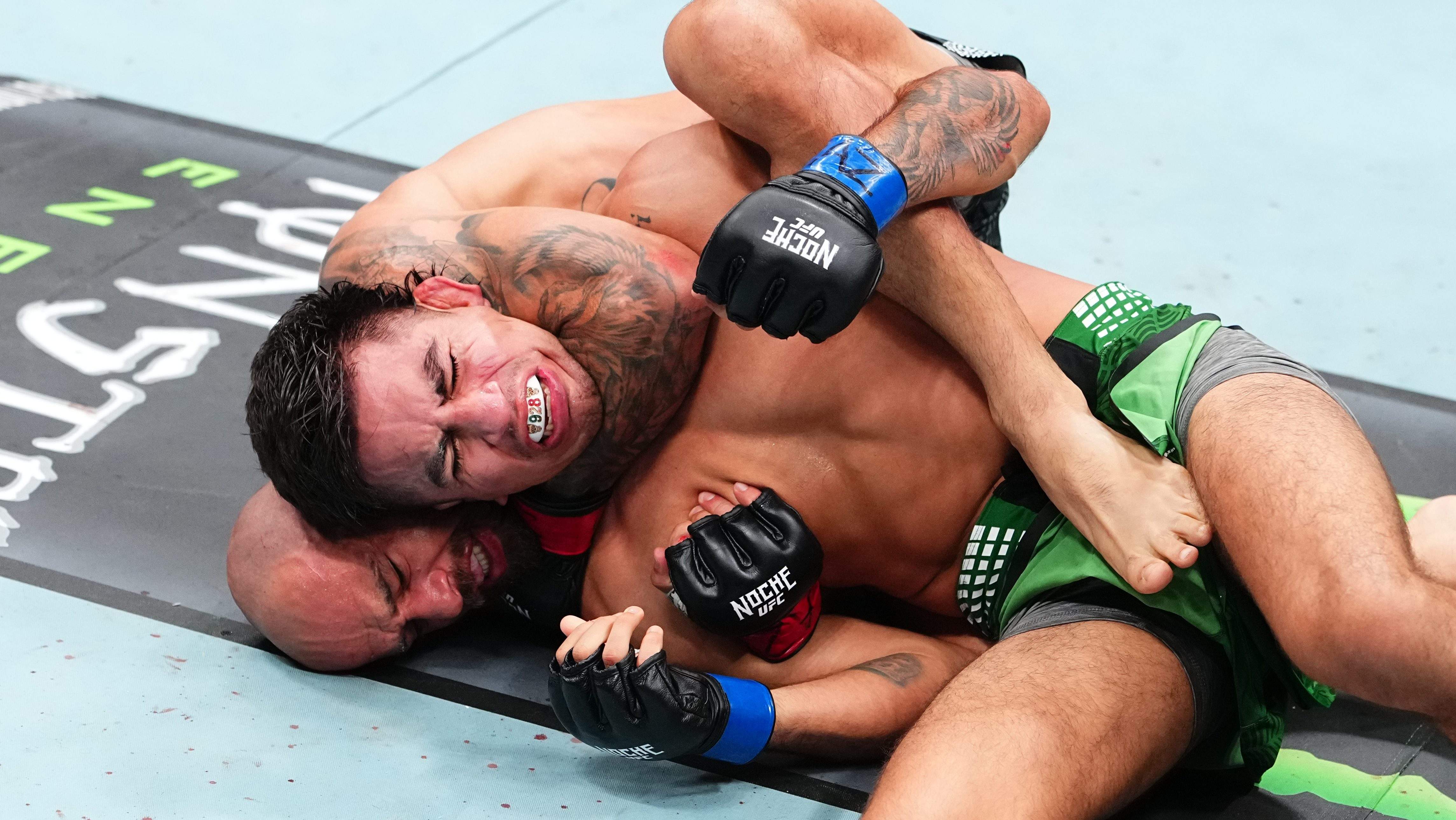 GLENDALE, ARIZONA - SEPTEMBER 12:  (L-R) Jean Silva of Brazil submits Jose Delgado in their featherweight fight during the Noche UFC event at Desert Diamond Arena on September 12, 2026 in Glendale, Arizona.  (Photo by Jeff Bottari/Zuffa LLC)