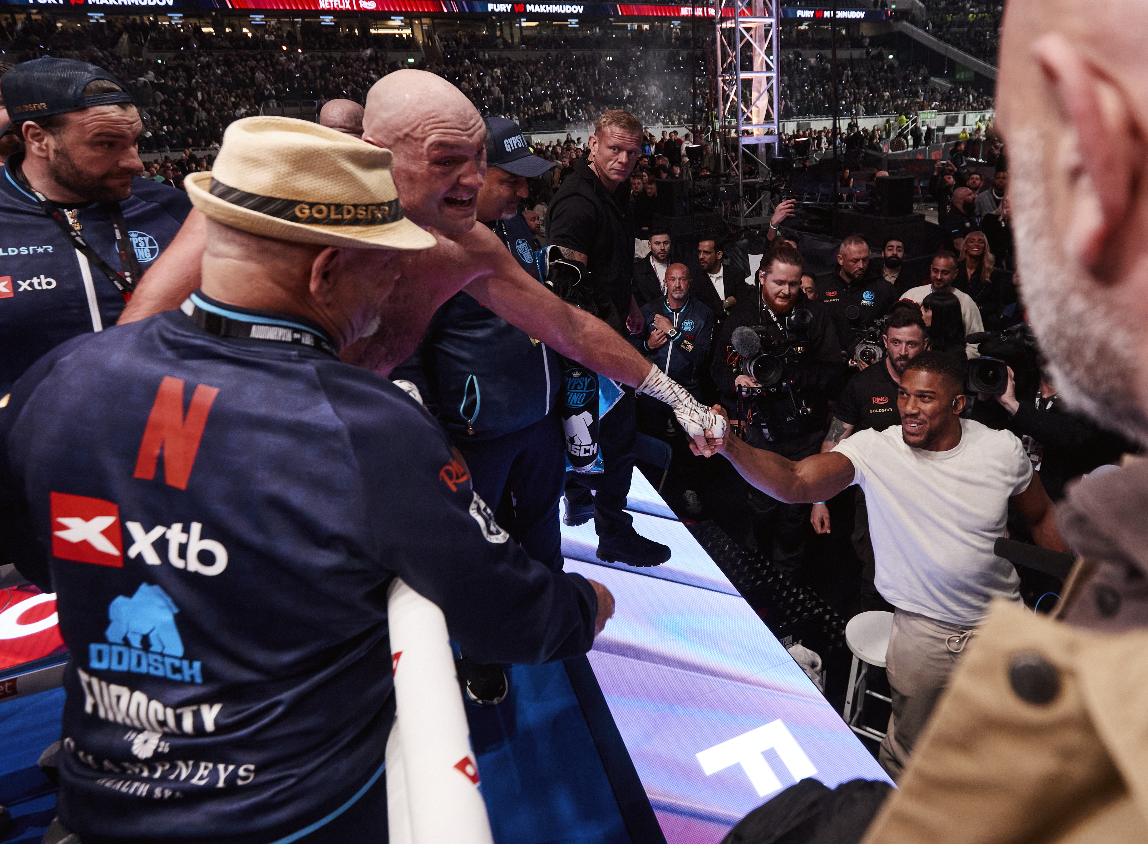 LONDON, ENGLAND - APRIL 11: Tyson Fury exchanges words with Anthony Joshua after his fight at Tottenham Hotspur Stadium on April 11, 2026 in London, England. (Photo by Mark Robinson/Getty Images)