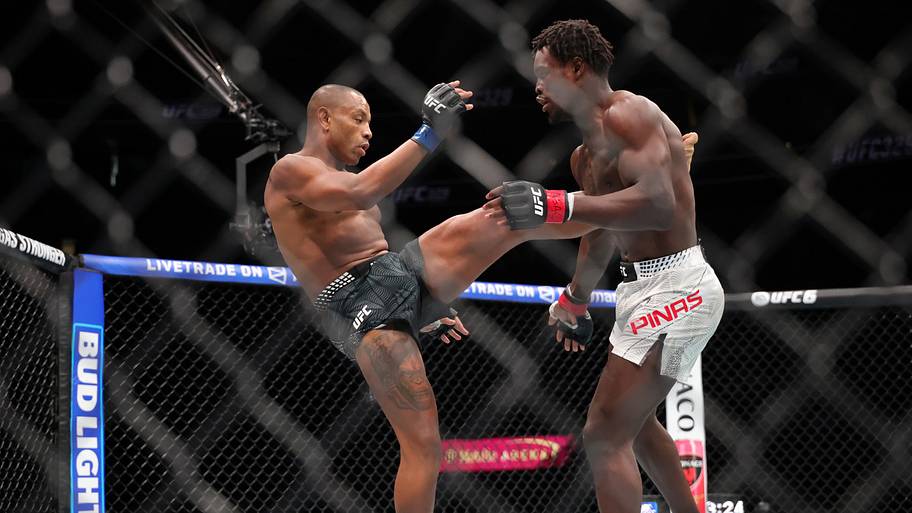 Damian Pinas (red gloves) fights Cesar Almeida (blue gloves) in a middleweight bout during UFC 329 at T-Mobile Arena.