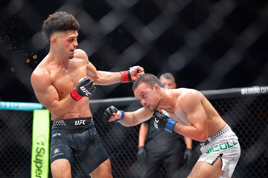 Alden Coria (red gloves) fights Stewart Nicoll (blue gloves) during UFC Fight Night at Paycom Center.